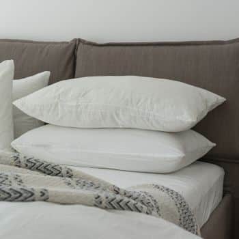 two big cosy pillows on the bed in focus