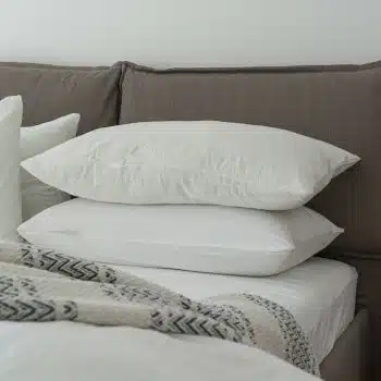 two big cosy pillows on the bed in focus